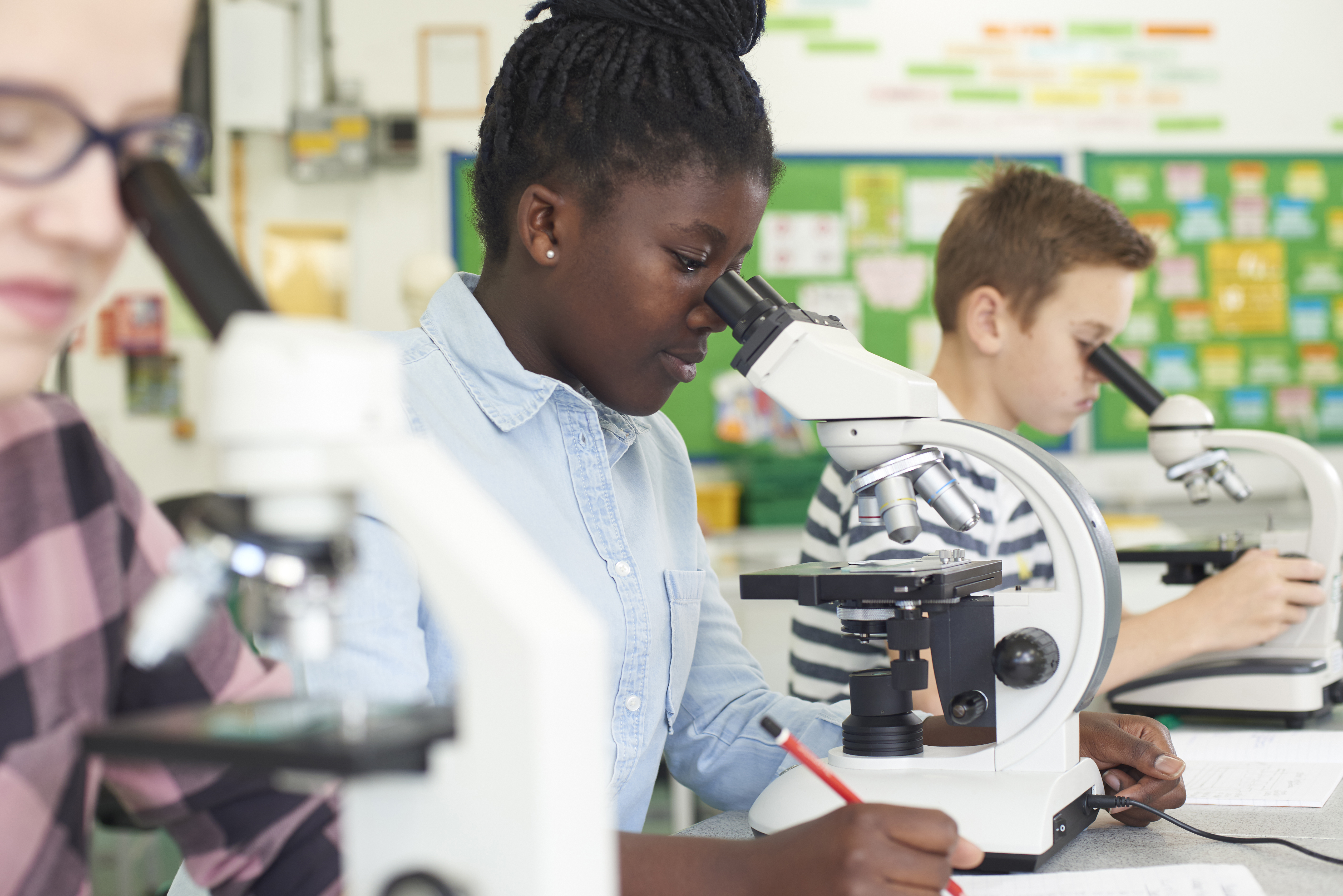 Girl looking in a microscope